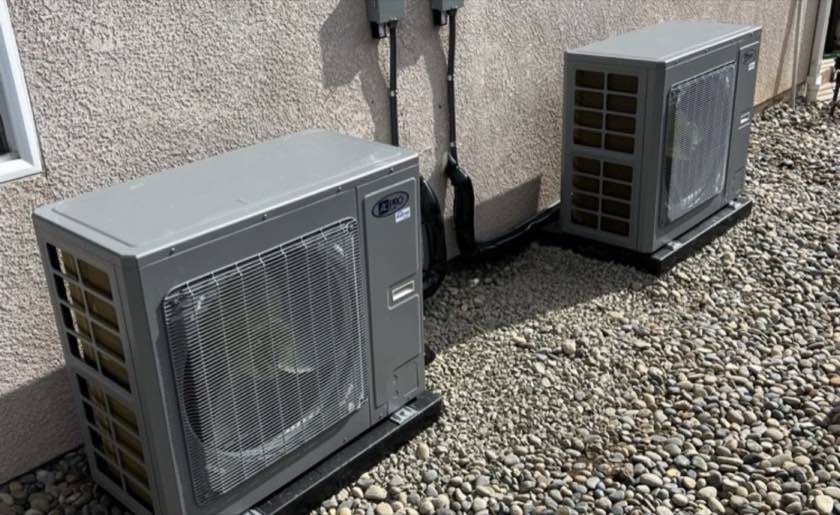Two outdoor condenser units installed by Prime Air Solutions